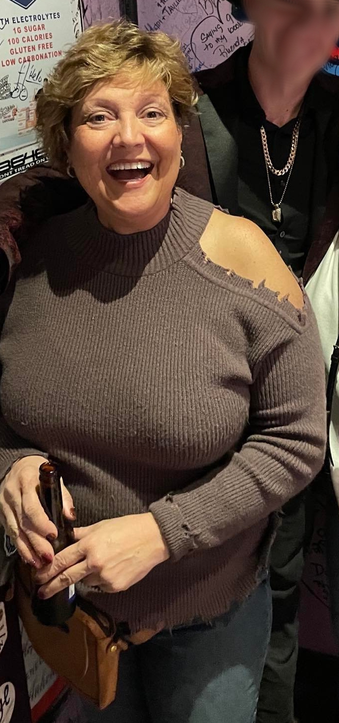 Kelly Welker Holding a Beer